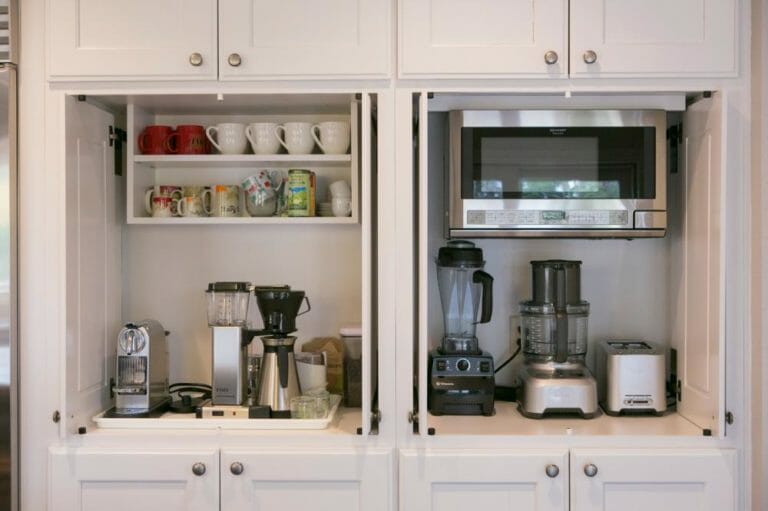 kitchen area with appliances and mugs
